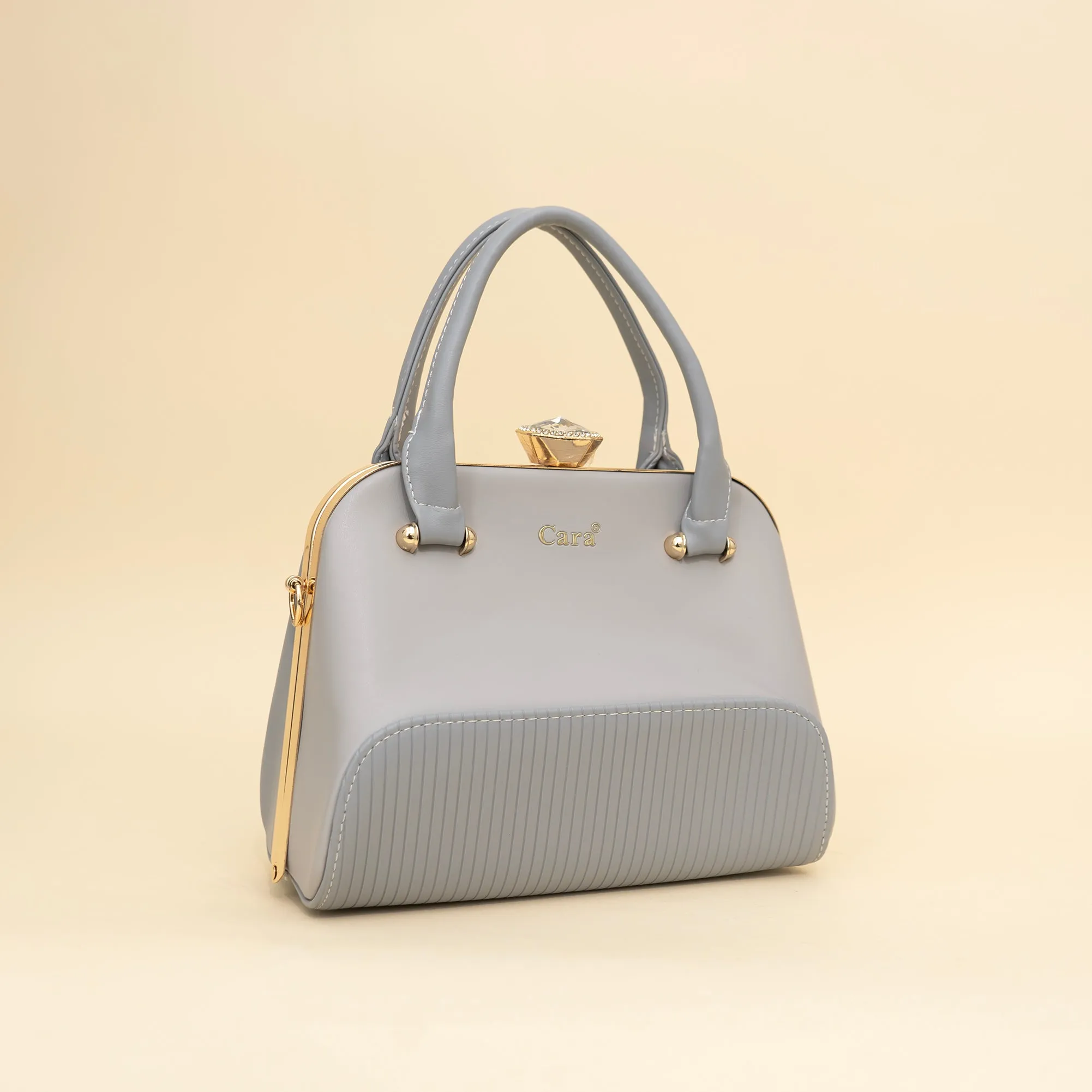 Cara's Glossy Glide satchel bag