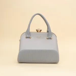 Cara's Glossy Glide satchel bag