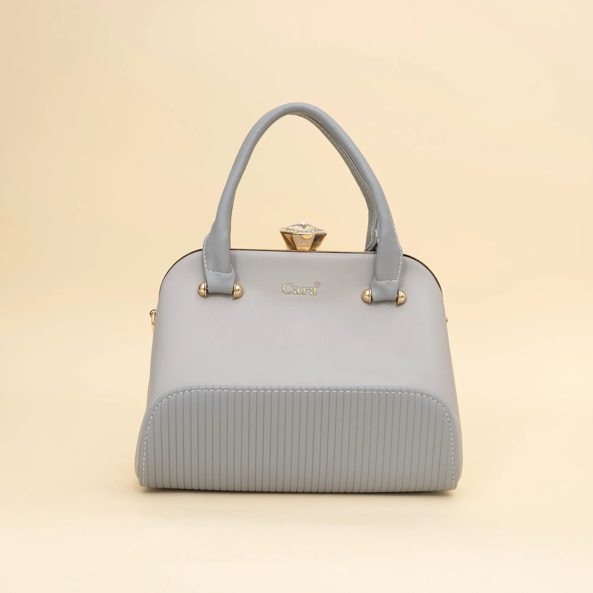 Cara's Glossy Glide satchel bag